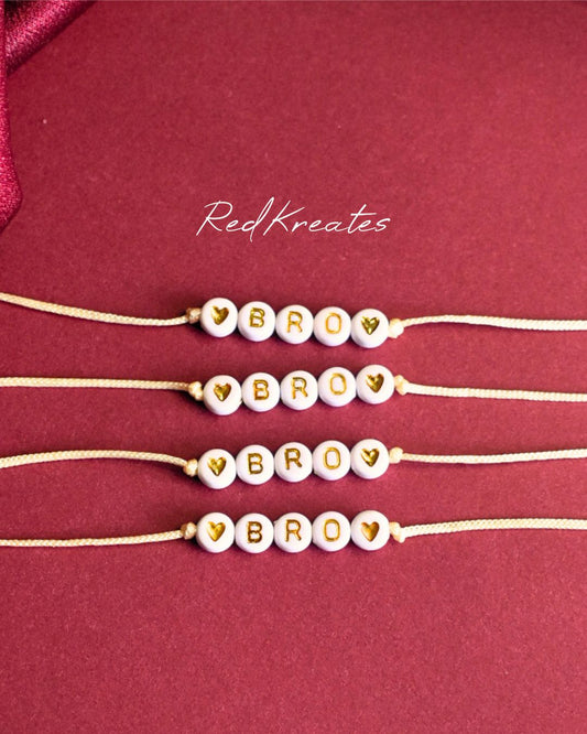 Beaded white and gold rakhi